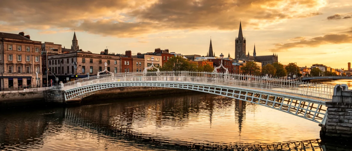 Ha'penny Bridge over the River Liffey in Dublin, Ireland at golden hour